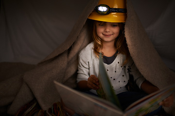 Image showing Happy child, bedroom and reading book at night with flashlight for learning, education and imagination. Girl or kid in blanket at home for story, creative and fantasy with adventure alone in dark