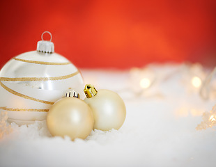 Image showing Christmas, decor and interior with bauble for December holiday or festive season on snow or studio background. Closeup of house decoration with ball, ornament or creative equipment on mockup space