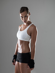 Image showing Woman, portrait and workout exercise for health in studio for performance, grey background or fitness. Female person, face and physical practice for weight loss or sport activity, training or mockup