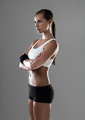 Image showing Woman, workout and confidence for exercise health in studio or performance training, grey background or fitness. Female person, gym and physical practice for weight loss or activity, cardio or mockup