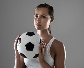 Image showing Woman, portrait and athlete with soccer ball for match, game or kick off on a gray studio background. Female person or football player ready for sports exercise, workout or training on mockup space