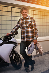 Image showing Mature, man and portrait with motorbike in city or travel journey for weekend trip, downtown or commute. Male person, face and transportation on sidewalk for urban New York, relax or holiday vacation