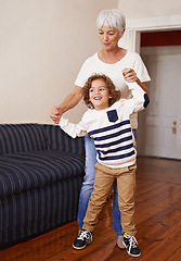 Image showing Grandmother, child and play in happy home, family fun with kid for children development. Walking, dance and happiness with elderly person and grandchild together, living room and bonding on holiday