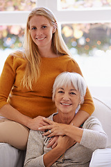 Image showing Senior mother, daughter and home with smile on sofa for bonding to relax, visit and break together. Portrait, parent and mom with happiness in living room for love, hug and satisfied as family.