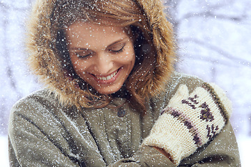 Image showing Happy, fashion and face of woman with snow outdoors for season, snowing weather and cold climate. Travel, forest and person smile in nature on winter holiday, vacation and weekend in Switzerland