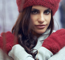 Image showing Fashion, beauty and portrait of woman with winter clothes on cold weather vacation or holiday. Serious, makeup and face of female person with gloves and beanie for trendy style for weekend trip.