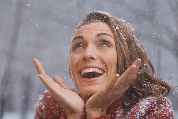 Image showing Winter, excited and face of woman with snow outdoors for season, snowing weather and cold climate. Snowflakes, fashion and happy person in nature on holiday, vacation and travel in Switzerland