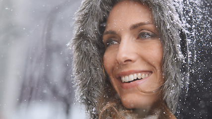 Image showing Happy, winter and face of woman with snow outdoors for season, snowing weather and cold climate. Travel, fashion and person in nature on holiday, vacation and weekend in Switzerland with snowflake