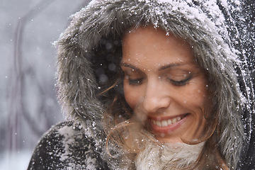 Image showing Woman, happy and eyes closed in nature with snow, winter season with fur coat for fashion, good mood and outdoor. Peace, calm and cold with comfort in jacket for weather, ice or frozen with smile