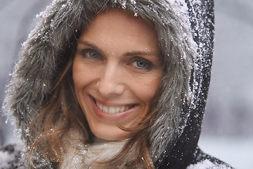 Image showing Happy woman, portrait and nature with snow, winter season and fur coat for fashion, good mood and outdoor in forest. Peace, calm and cold with comfort in jacket for weather, ice or frozen with travel