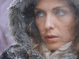 Image showing Snow, woman and thinking in nature with cold climate and weather with winter fashion and idea. Ice, travel and freezing outdoor with a female person in Antartica with frost in a storm with jacket