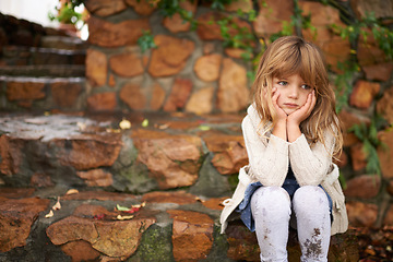 Image showing Thinking, sad and girl child in a garden bored, waiting or disappointed, unhappy or moody outside. Children, problem and frustrated kid in a park lonely, moody or upset outdoor with angry or tantrum