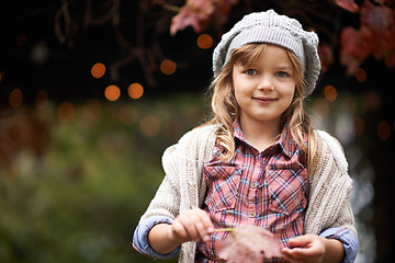Image showing Happy, autumn and portrait of child in park with smile for weekend, face and adventure outdoors. Childhood, happiness and young girl with plants in nature for playing, relaxing and fun in garden