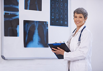 Image showing Senior doctor, woman and clipboard in radiology for surgery with anatomy scan and healthcare in portrait. Medical professional, treatment and surgeon in room for xray, medicine and confident expert