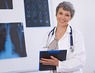 Image showing Doctor, woman and portrait with clipboard, radiology for surgery with anatomy scan and healthcare. Senior medical professional, treatment and surgeon in room for xray, checklist and confident expert