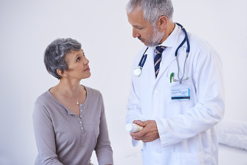 Image showing Hospital, consulting and doctor with pills for patient for prescription, medicine and treatment. Healthcare, medication and senior woman in consultation for medical service, wellness and diagnosis