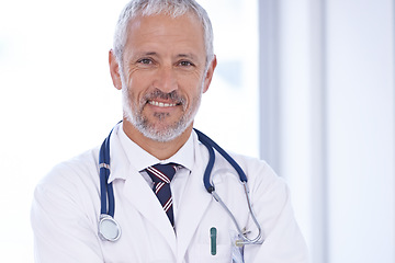 Image showing Doctor, portrait and happy senior man in consultation room for medical, advice or help at hospital. Healthcare, face or male health expert with career pride, smile or ready for consulting at a clinic