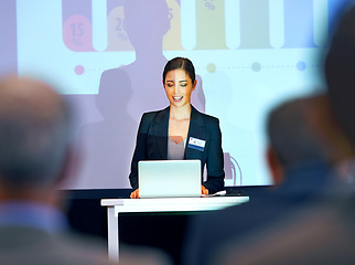 Image showing Business woman, podium and presentation with projector screen, conference or workshop with laptop for slideshow. Corporate training, seminar and speaker with info, audience and professional speech