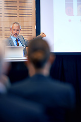 Image showing Senior, businessman and manager with presentation on projector for meeting, seminar or conference at office. Mature man, CEO or speaker talking on podium to group or corporate audience at workshop