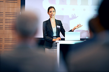 Image showing Business woman, talking and presentation with projector screen, conference or workshop with laptop for slideshow. Corporate training, seminar and speaker with info, audience and professional speech