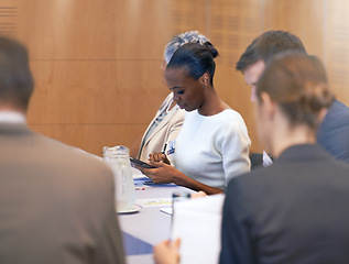 Image showing Meeting, secretary and woman with tablet for notes in board room for discussion of stock market. Directors, women and male people in collaboration for strategy in sales and talk for report in job