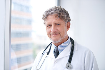 Image showing Senior man, doctor and smile portrait in office for healthcare, medical support and medicine career with stethoscope. Mature, face and health expert with confidence and happy for cardiology in clinic