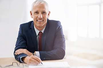 Image showing Office, documents and portrait of business man with confidence for career, job and working at desk. Professional, startup agency and senior person writing notes for company pride, smile and planning