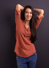 Image showing Portrait, fashion and woman in studio background, smile and cool for trendy style. Female model, pride and confidence with happiness, stylish and edgy girl in casual outfit or clothes from mexico