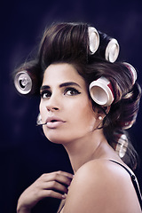 Image showing Studio, rollers and haircare for woman with glamour, creative and curling with cans for soda on head. Adult, girl and female person with confidence of style, texture and model with aesthetic