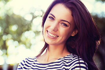 Image showing Person, portrait and smile with nature, sunshine and park for happiness and wellness. Woman, joy and bokeh with closeup, glow and beauty for summer relax and adventure outside in garden with trees