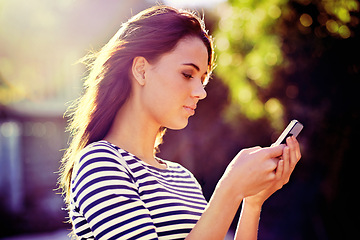Image showing Outdoor, sunshine and woman with smartphone, typing and internet with social media or website info. Cellphone, girl in a city or mobile user with digital app or tech with online reading, blog or news