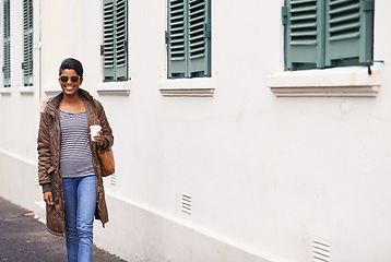 Image showing Coffee, fashion and woman on holiday, street and happy to explore city of Cape Town and sightsee. Adult, female person and girl with sunglasses, coat and stylish with smile in morning on road