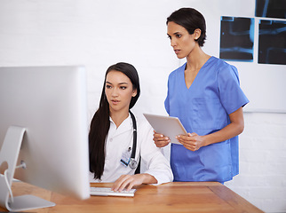 Image showing Computer, doctor and nurse with report in hospital, medical facility or clinic for health and medicine. Women, people and healthcare workers with technology, research and analysis of results