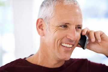 Image showing Senior, man and happy with phone call in home for communication, discussion and mobile chat on weekend. Elderly, person and smile with smartphone for talking, retirement and networking in living room