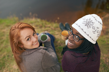 Image showing Camping, friends and portrait of women by lake in nature on outdoor holiday, vacation and adventure, Campsite, travel and people bonding with coffee or drink in woods, forest and countryside together
