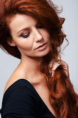 Image showing Face, beauty and hair with redhead woman in studio isolated on white background for natural wellness. Skincare, shampoo and cosmetics with confident model at spa for keratin haircare treatment