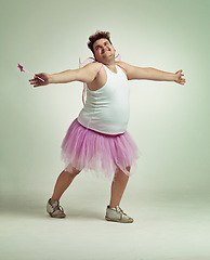 Image showing Fairy, man and studio for magic and isolated, happy male person with wings and pretend costume. Pink Cosplay, fun and plus size model, dress up or play on white background for halloween on backdrop