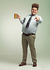 Image showing Man, portrait and pointing to you with beer for celebration, drink or party on a studio background. Male person or plus size model with glass or mug for beverage, wine or drinking on mockup space