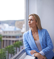 Image showing Thinking, window and business woman in office with idea, brainstorming project or planning. Professional worker, city view and thoughtful person for strategy, problem solving or solution in workplace