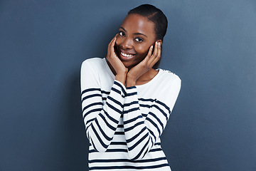 Image showing Portrait, smile and black woman with reaction, shy and expression on a grey studio background. Face, person and model with social anxiety and embarrassed with mockup space and happy girl with emoji