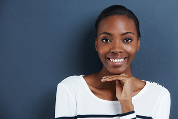 Image showing Portrait, thinking and smile with black woman, choice and decision on a grey studio background. Face, African person and model with mockup space and girl with solution and ideas with problem solving