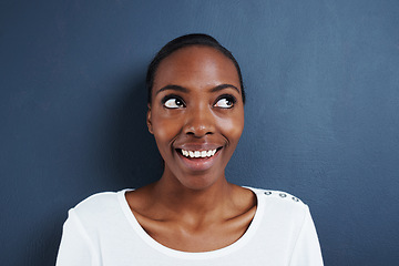 Image showing Thinking, idea and happy black woman in studio with solution, insight or conclusion on blue background. Planning, problem solving and African female model with curious emoji for inspiration or memory