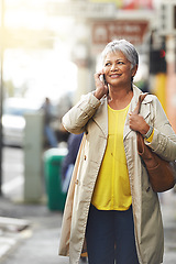 Image showing Senior woman, phone call and smile for walk and relax in city for free time or travel on sidewalk for fashion, retired and elderly. Happy person and pensioner with cell for talk, enjoy and trend