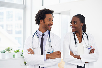 Image showing Black people, smile and doctors with arms crossed for healthcare, confidence in medicine and team at hospital. Cardiovascular surgeon, health and medical professional collaboration with pride