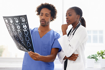 Image showing Doctor, nurse and study xray for health, collaboration for surgery and treatment plan with anatomy. Black people review abdominal CAT scan, MRI or radiology, medicine and surgeon with team at clinic