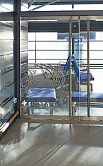 Image showing Waiting room, chairs and interior design in airport to relax, traveling, schedule and sitting for flight. Architecture, modern seat and creative with windows, light and comfortable in reception