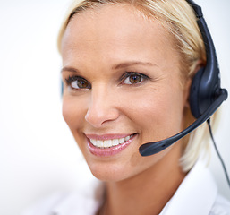 Image showing Woman, happy and portrait in call center with mic for networking, telemarketing and contact at crm job. Person, smile and headphones with for voip communication, customer service and tech support