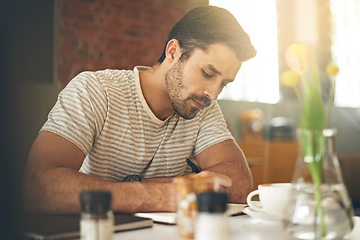 Image showing Man, coffee shop and freelancer for writing notes, inspiration and writer for creativity in restaurant. Male person, journal and plan for story or author, calm and peace in cafe for script project