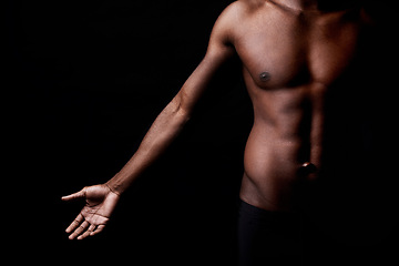 Image showing Black man, body, and muscle with fitness in shadow for exercise or workout on a dark studio background. Closeup of young African male person or bodybuilder with masculine or muscular figure on mockup