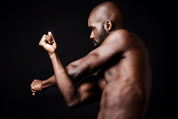 Image showing Black man, fitness and stretching arms with muscle in workout, exercise or training on a dark studio background. Muscular African, male person or bodybuilder in body warm up or health on mockup space